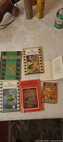 Six books laid out on table
