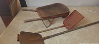 Wheelbarrow and both shovels overall