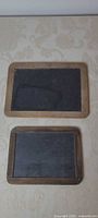 Both chalkboards front view showing size difference