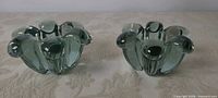 Pair of green art glass candle holders front view