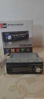 Front view of Dual XDM260 receiver with box