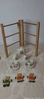 Entire lot showing tea set, wooden rack, bear figures
