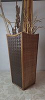 Full view of square bamboo-rattan vase with dried arrangement