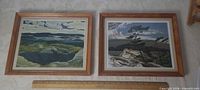 Both framed prints side by side with ruler for scale