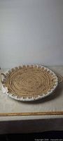 Full view of round basket tray on table