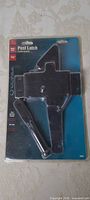 Front of sealed Ultra Post Latch package showing latch and lever rod