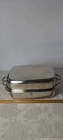 Closed roasting pan showing exterior and handles