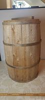 Full view of upright wooden barrel