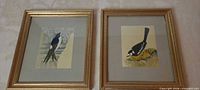 Both framed prints side by side