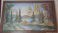Front view of framed oil landscape painting