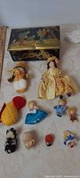 Group shot showing tin box, cloth dolls, plush toys