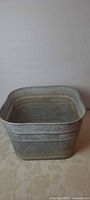 Full exterior view of square galvanized washtub