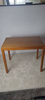 Front angled view of teak side table