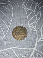 Obverse view showing coat of arms and wreath on 1841 Canadian half penny