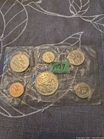 Front view of sealed 1977 Canadian coin set showing all coins