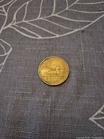 Reverse side of 1988 Canadian loonie showing loon and denomination