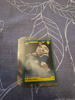 Front view of card in sleeve showing player image and details