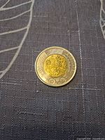 Reverse view displaying commemorative design and denomination