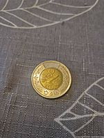 Reverse side showing aviation design of 2024 Canadian toonie