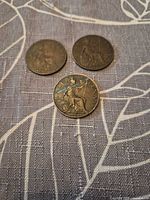 Three bronze halfpennies reverse side with Britannia designs