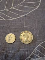 Obverse of both coins showing Queen Elizabeth II portraits
