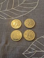 Obverse sides showing Olympic sport designs