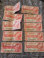 Fronts of all ten 10¢ Canadian Tire coupons showing portrait and value