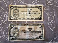 Fronts of 5¢ and 25¢ coupons showing denomination and branding