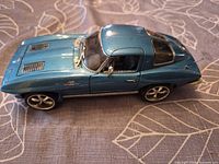Left side view of blue 1963 Corvette Sting Ray diecast model