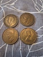 Obverse sides of all four coins