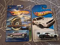 Front view of both Hot Wheels blister packs showing models and card fronts