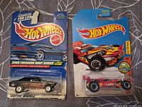 Front view of both sealed Hot Wheels cars on original cards