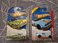 Front view of both carded Hot Wheels cars
