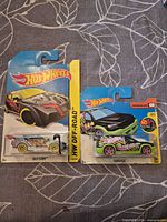Front view of both sealed Hot Wheels cards