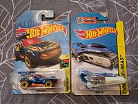 Front view of both blister-carded Hot Wheels cars