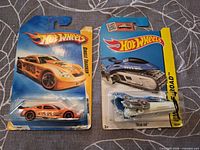 Front view of both Hot Wheels carded cars