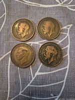 Obverse view of all four one-penny coins