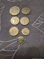 All seven coins front side view