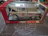 Front view of boxed diecast truck in window package
