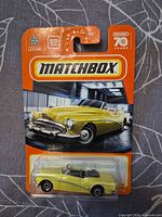 Front of sealed Matchbox blister card showing yellow 1953 Buick Skylark Convertible model