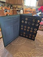 Interior first page 1920-1943 side with coins inserted