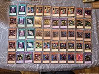 Full layout of all 50 sleeved Yu-Gi-Oh! cards on tabletop