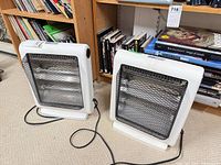 Front view of both Air Works QH8 heaters showing grills and bases