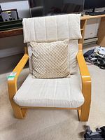 Front view of IKEA Poäng chair with pillow