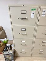 Front view showing all four drawers, pull handles, label holders, lot tag 728