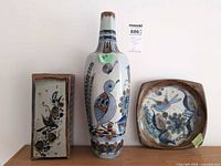Group shot of two vases and plate showing overall design and scale