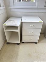 Two white rolling cabinets side by side, showing overall design and scale