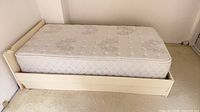 overall view of twin bed frame with mattress