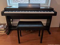 Full front view of Yamaha Clavinova CLP-50 with bench