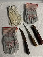 Overview of all three glove pairs and three knives